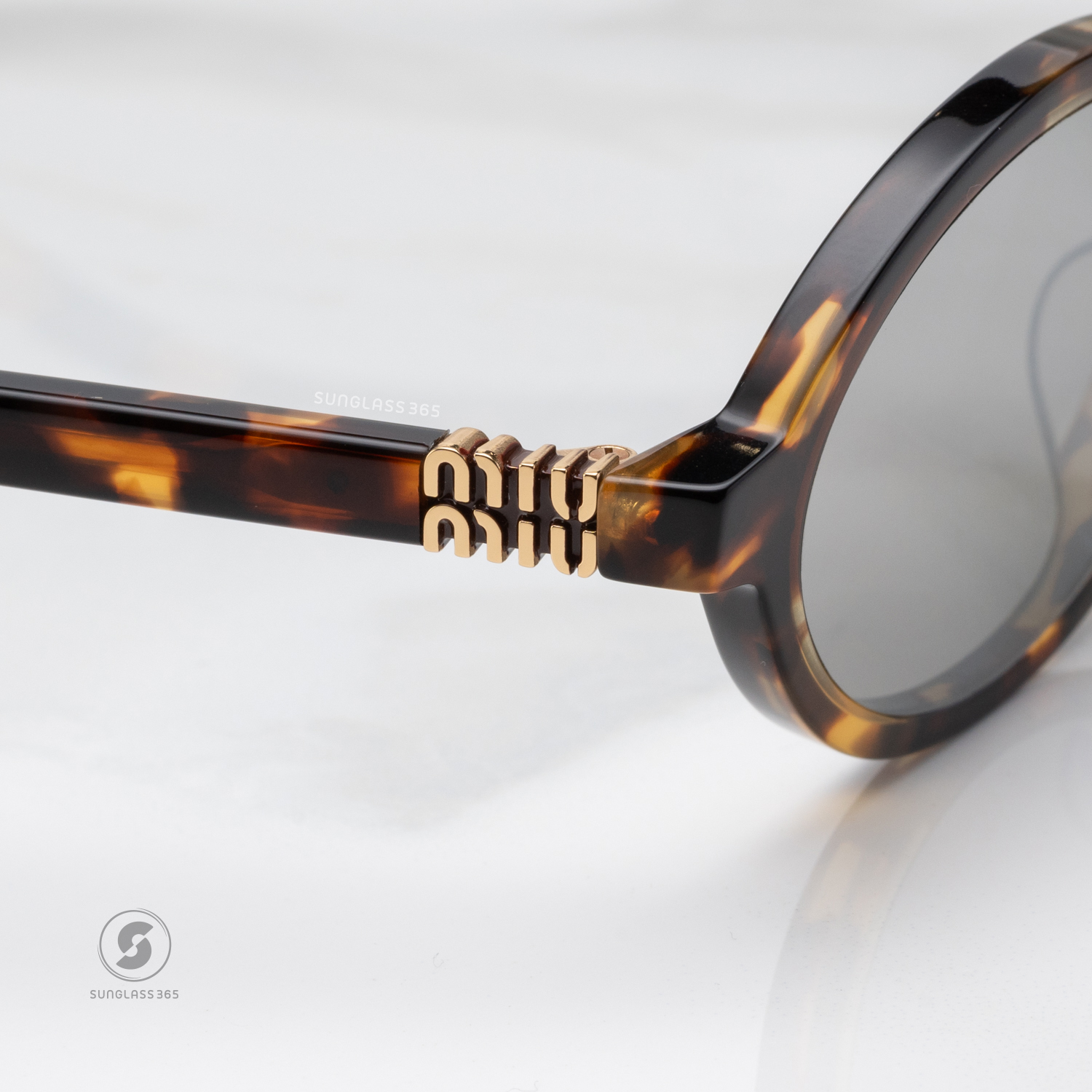 แว่นกันแดด Miu Miu MU04ZSF VAU07F