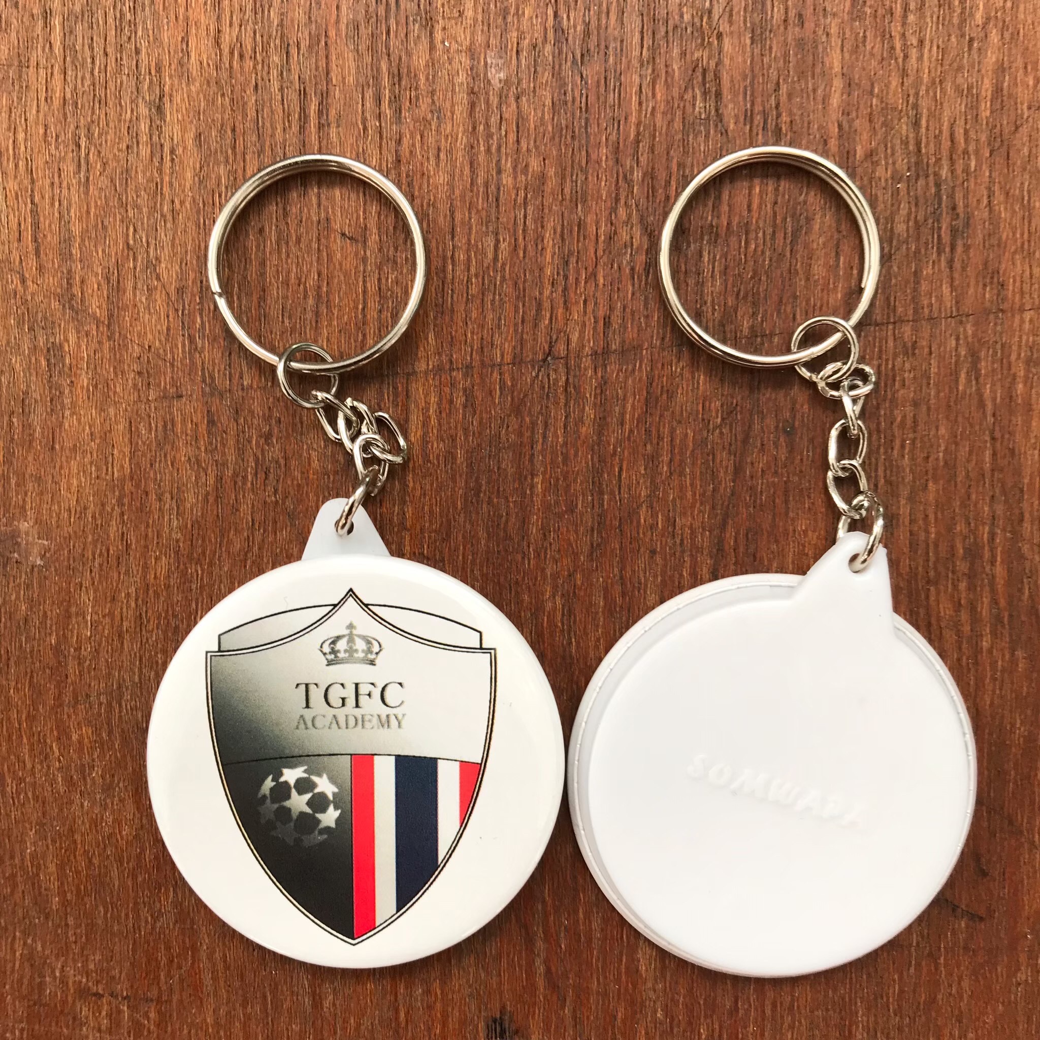 พวงกุญเเจพลาสติกวงกลม รับผลิตพวงกุญแจสกรีนลายโลโก้