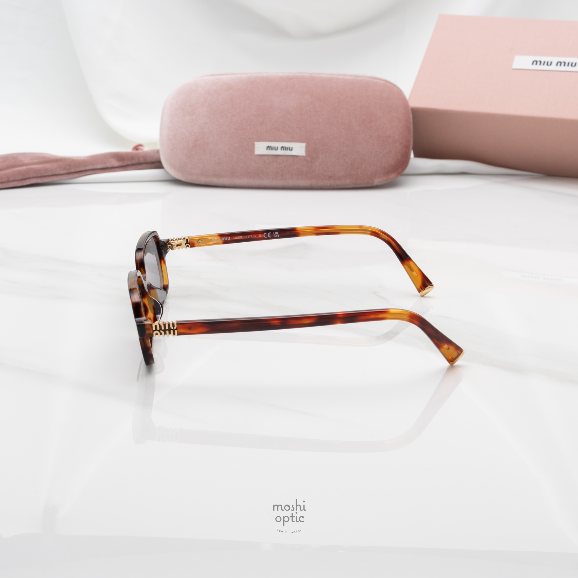 แว่นกันแดด Miu Miu MU11ZSF 21C40O
