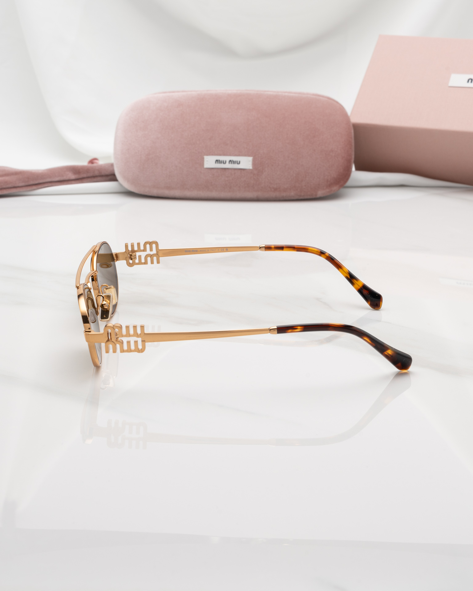แว่นกันแดด Miu Miu MU54ZS 70E09Z