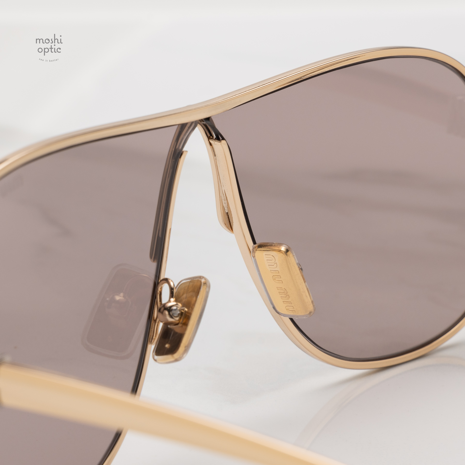 แว่นกันแดด Miu Miu MUA56S 5AK20I