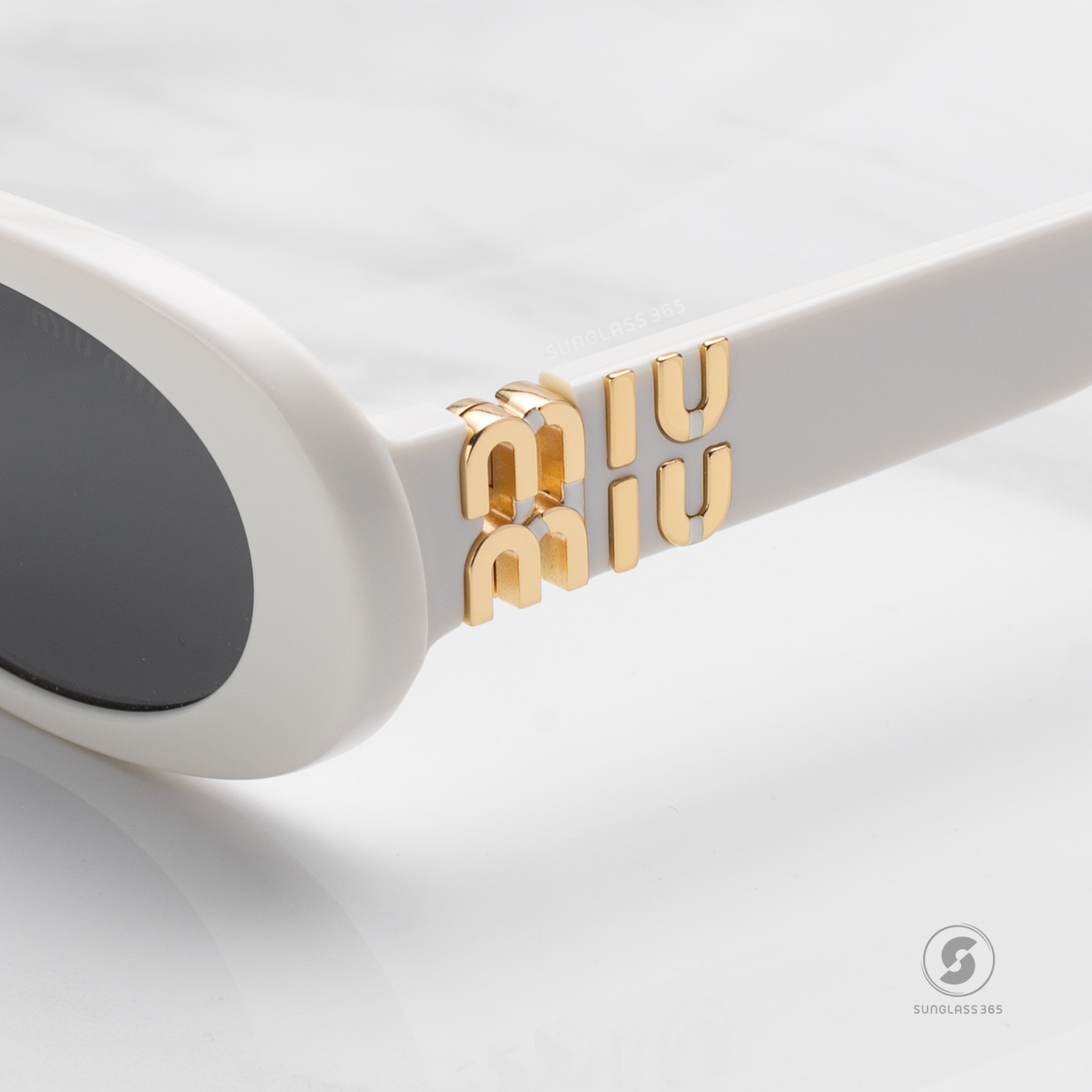 แว่นกันแดด Miu Miu MU06ZS 1425S0