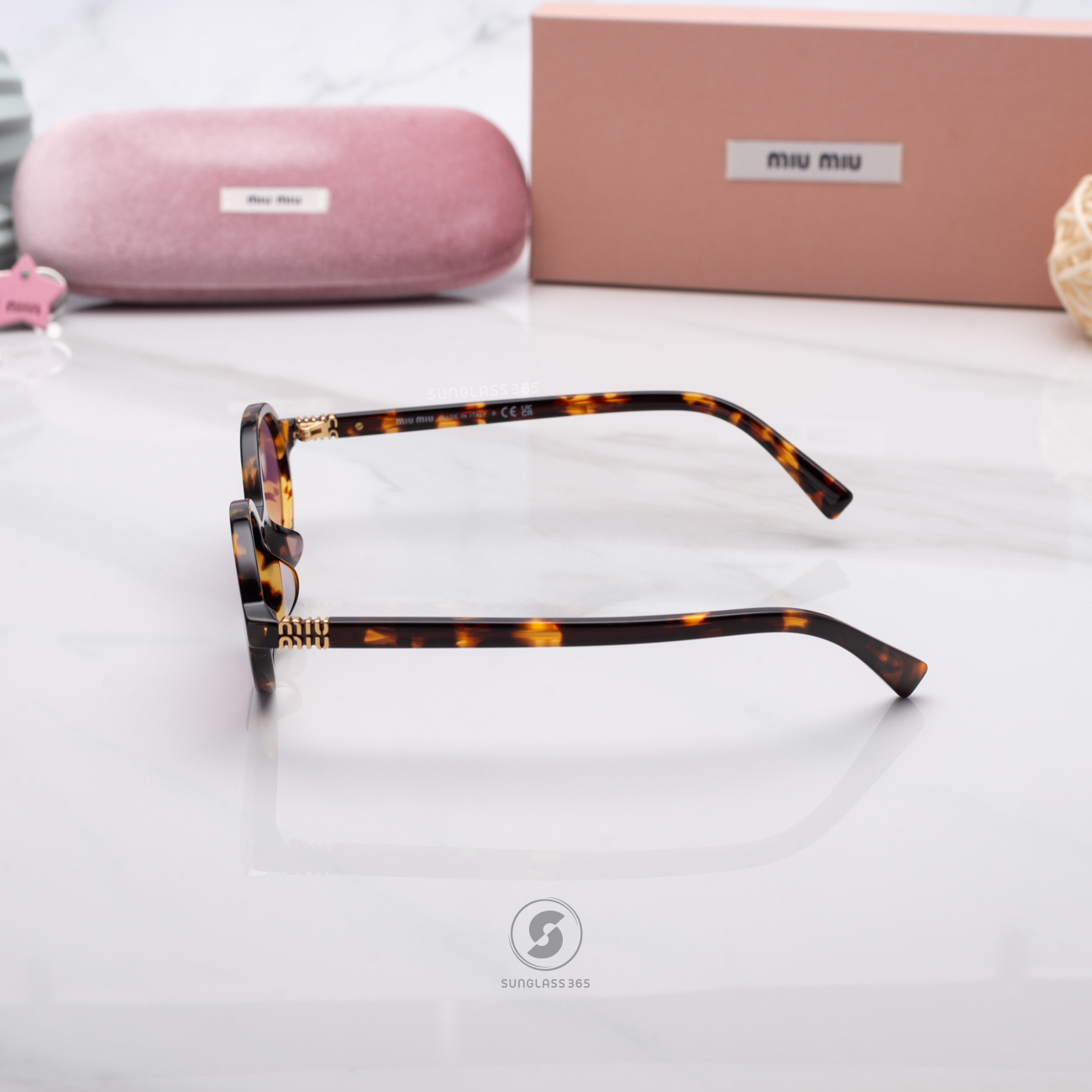 แว่นกันแดด Miu Miu MU04ZSF VAU50D