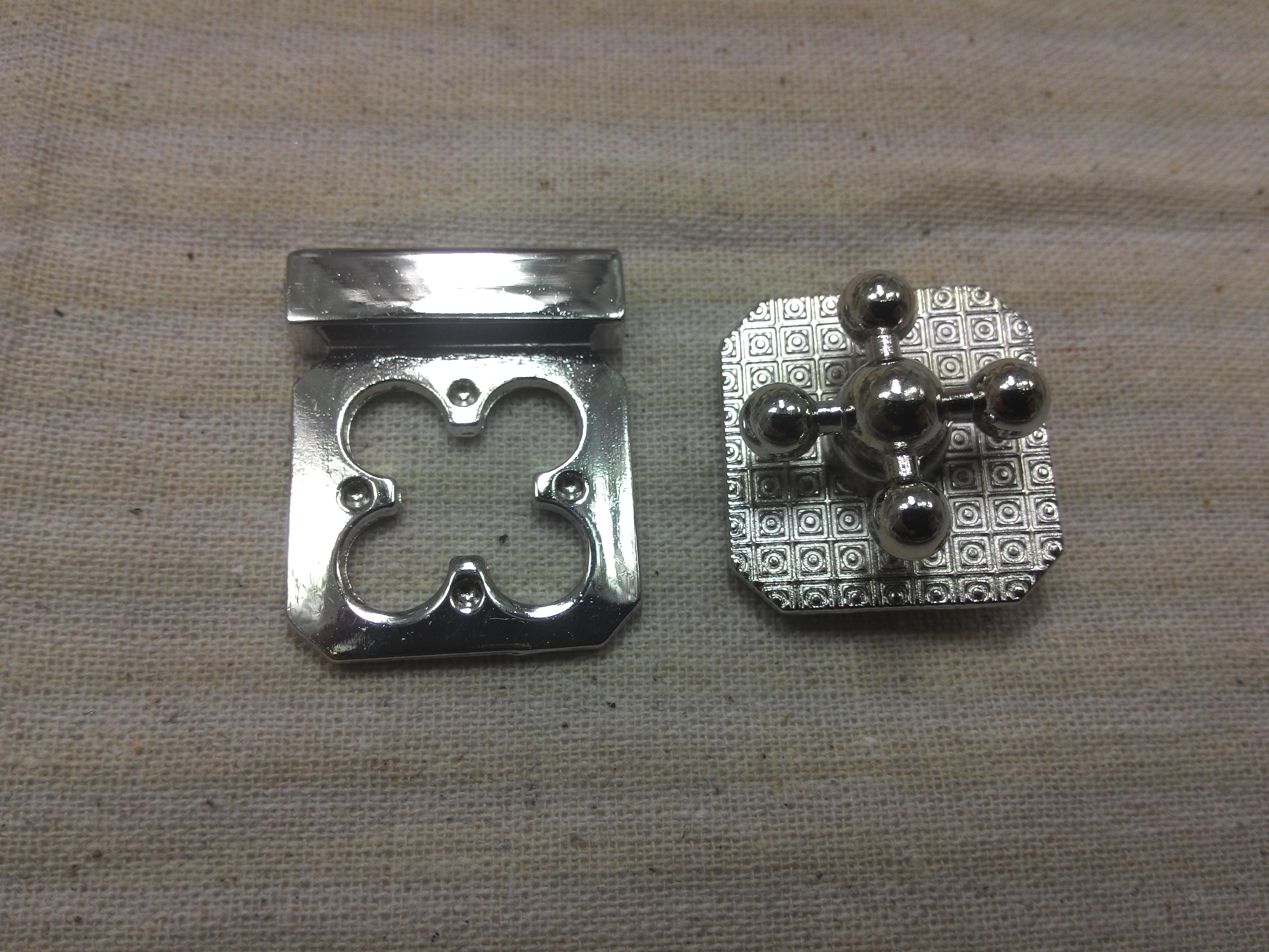 หน้ากระเป๋าลูกบิดเล็ก เงิน