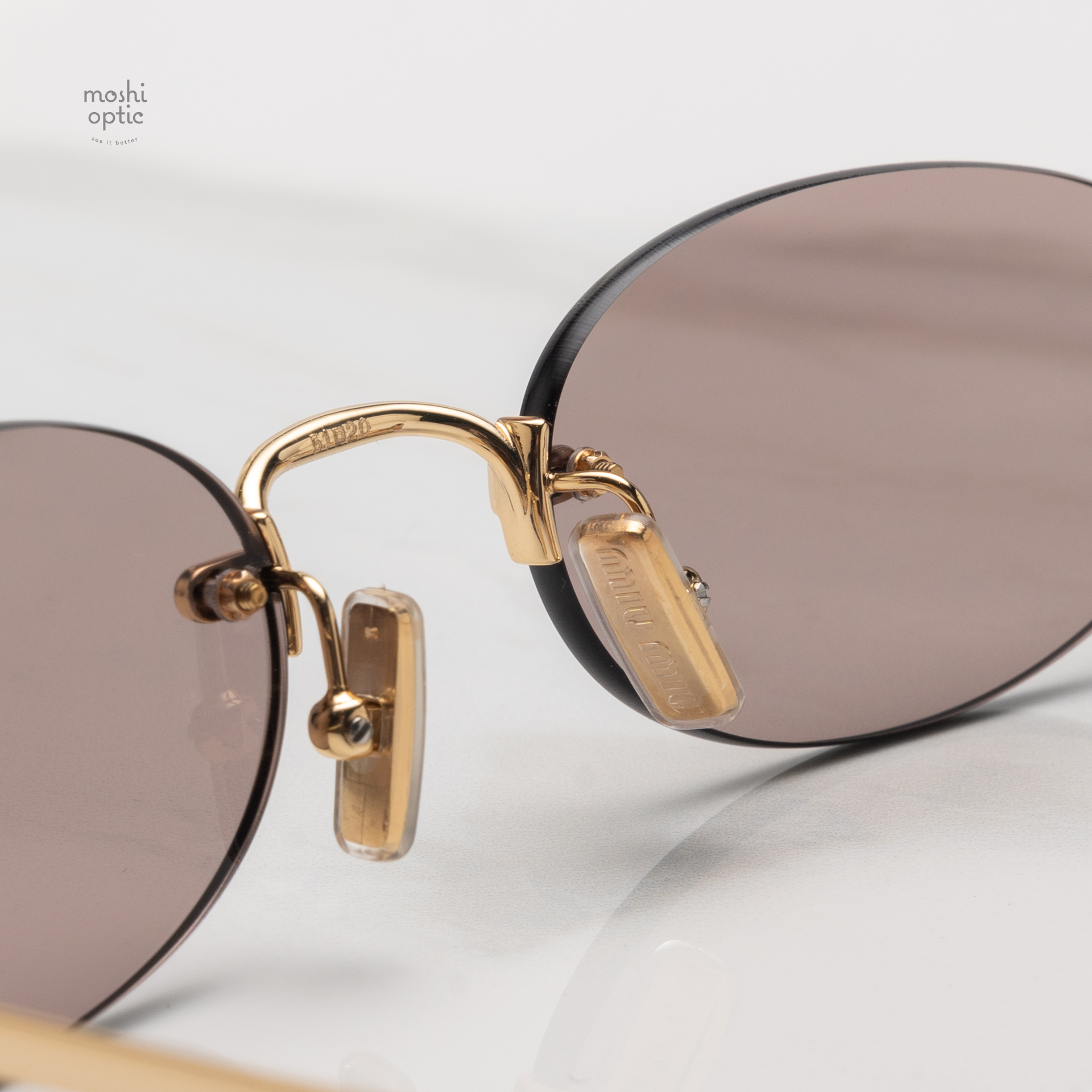 แว่นกันแดด Miu Miu MUA54S 5AK20I